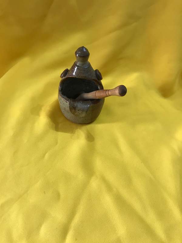 Pottery bowl with wooden spoon