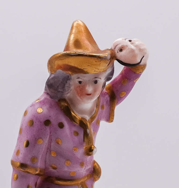 Antique German Porcelain Harlequin Figurine  Hand Painted, Gilt Accents, Holding Mask