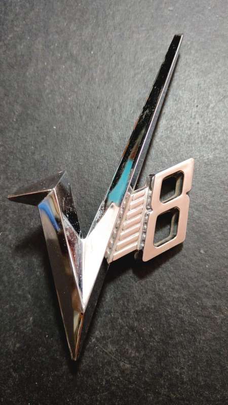 V8 vehicle badge
