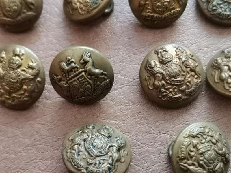 27 brass military buttons