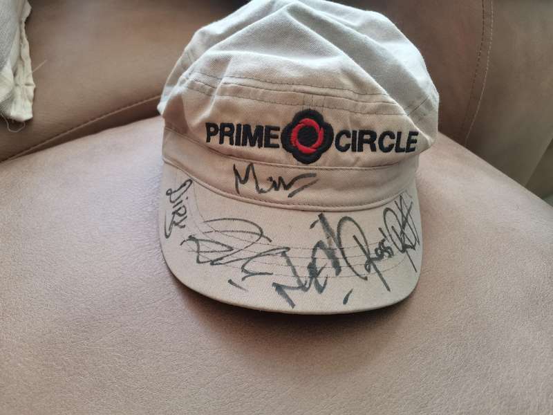 Prime circle Cap autographed by the Band