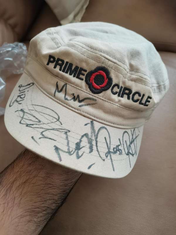 Prime circle Cap autographed by the Band