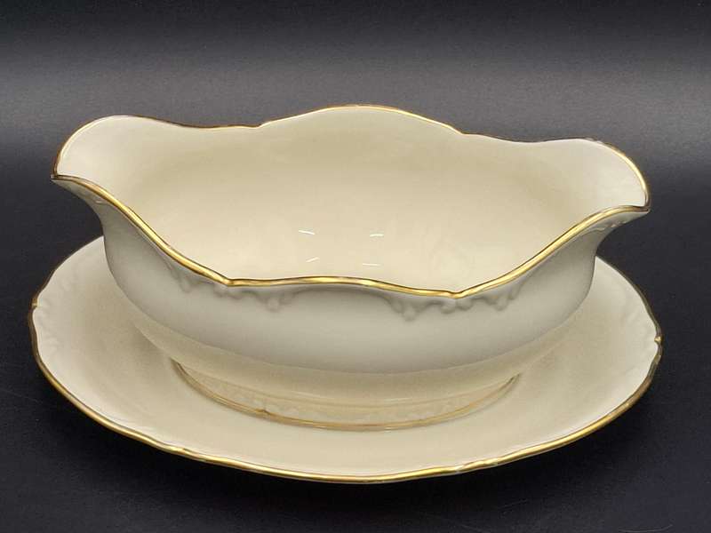 Vintage Porsgrunn Norge - 33 piece dinnerware in ivory with gold trim - designer Nora Gunderson