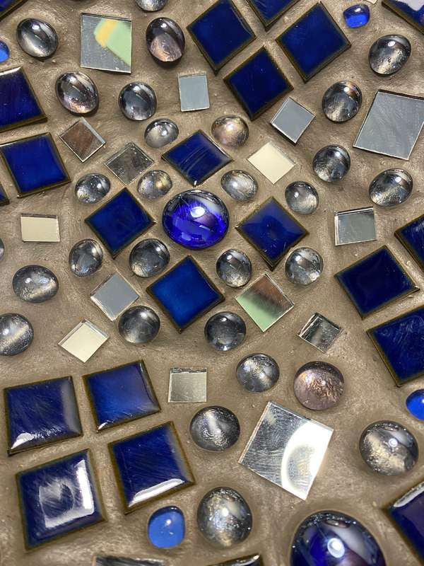Stainless steel  bowl with tile, mirror, and glass marble inlay