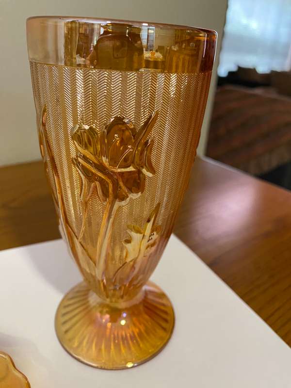Carnival glass "Iris and herringbone" pedestal tumbler and saucer