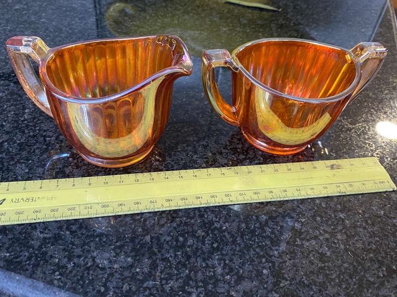 Antique carnival glass sugar bowl and creamer