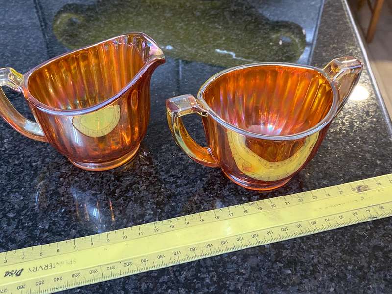 Antique carnival glass sugar bowl and creamer