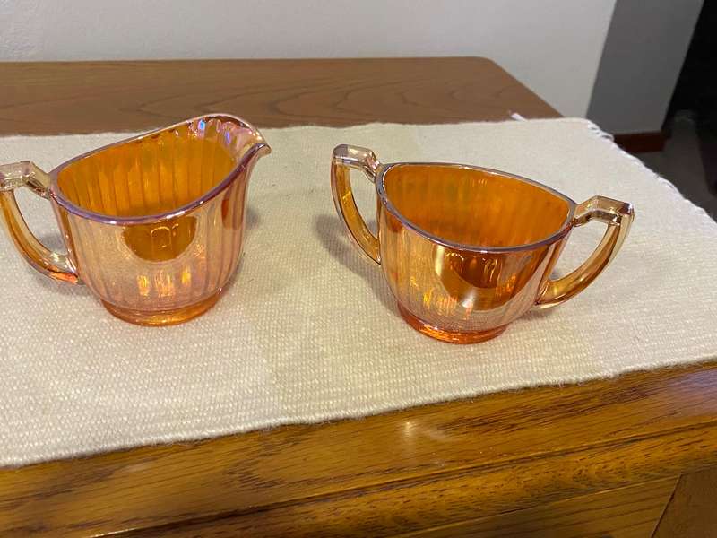 Antique carnival glass sugar bowl and creamer