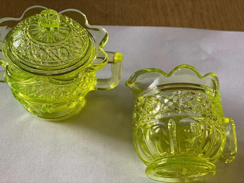 Vaseline glass creamer and sugar bowl with lid