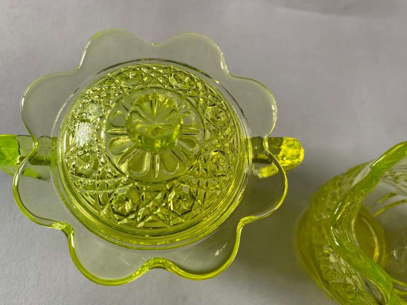 Vaseline glass creamer and sugar bowl with lid