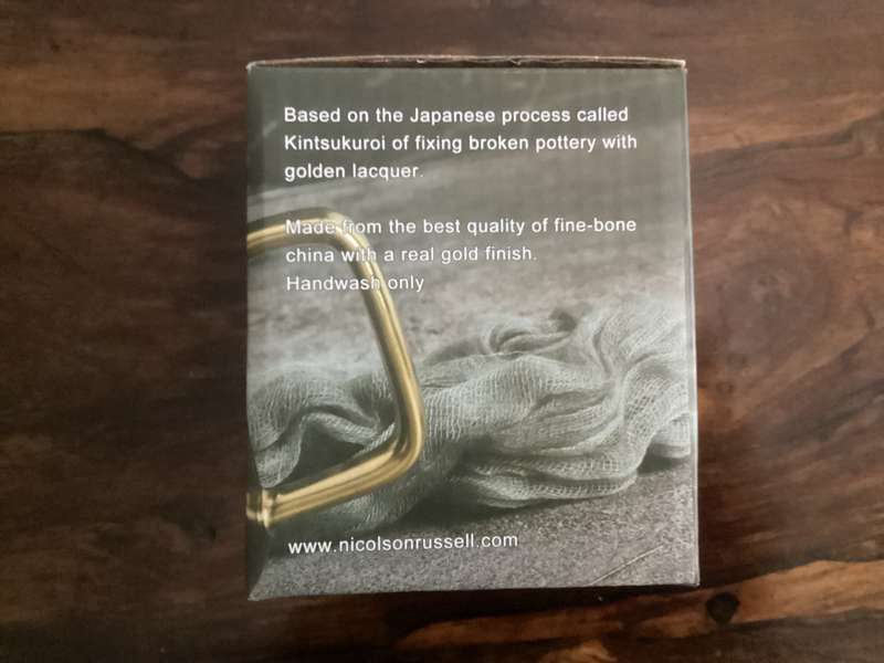Kintsukuroi, fine bone China mug, with acacia wooden base. New.