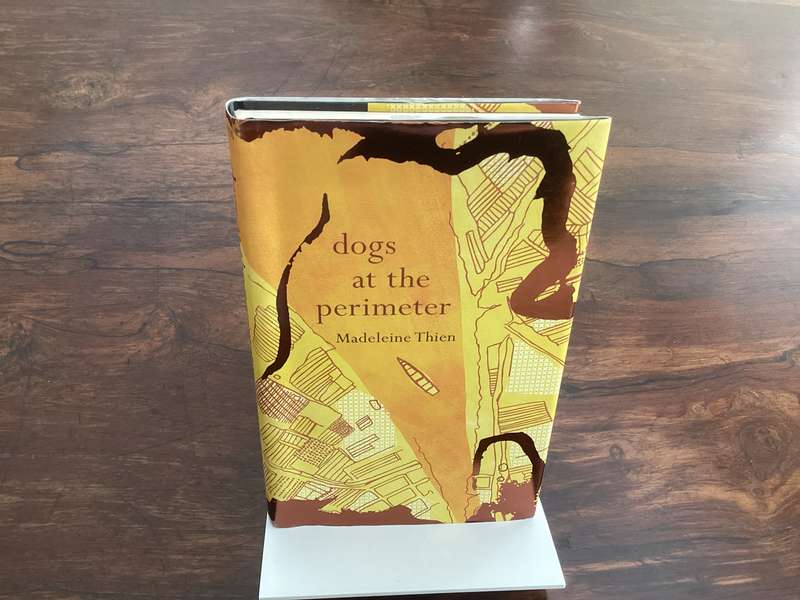 DOGS at the PERIMETER, by Madeleine Thien. Hardcover, in a new condition.