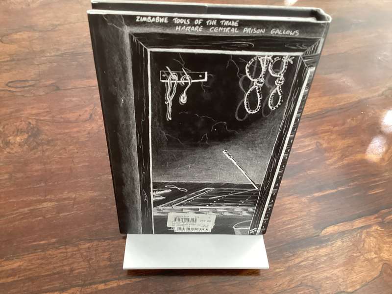 THE KEVIN WOODS STORY: In the shadow of Mugabes gallows. Hardcover in excellent condition.
