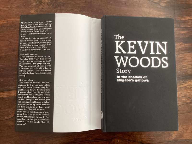 THE KEVIN WOODS STORY: In the shadow of Mugabes gallows. Hardcover in excellent condition.