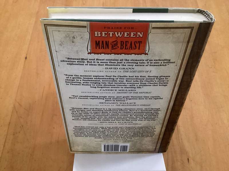 BETWEEN MAN and BEAST. True Story, by Monte Reel. Hardcover in a VG+ condition.