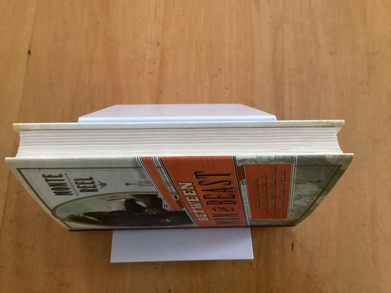 BETWEEN MAN and BEAST. True Story, by Monte Reel. Hardcover in a VG+ condition.