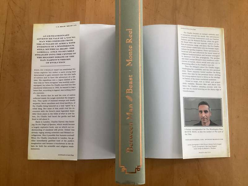 BETWEEN MAN and BEAST. True Story, by Monte Reel. Hardcover in a VG+ condition.