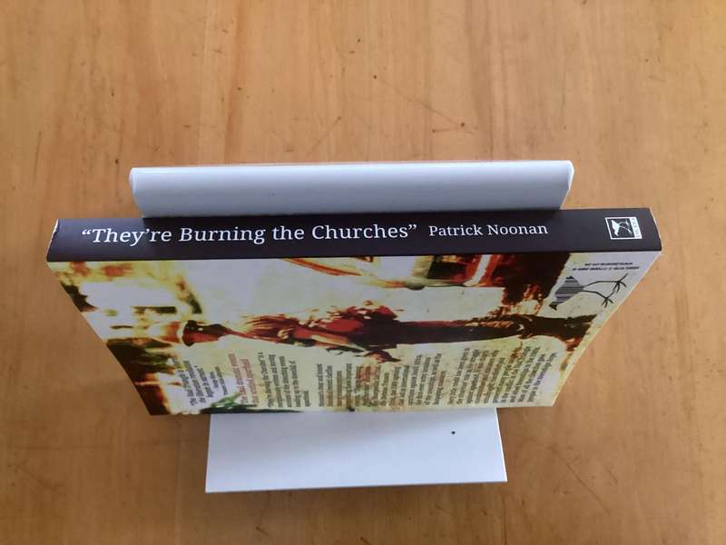THEYRE BURNING THE CHURCHES, by Patrick Noonan, paperback excellent condition.