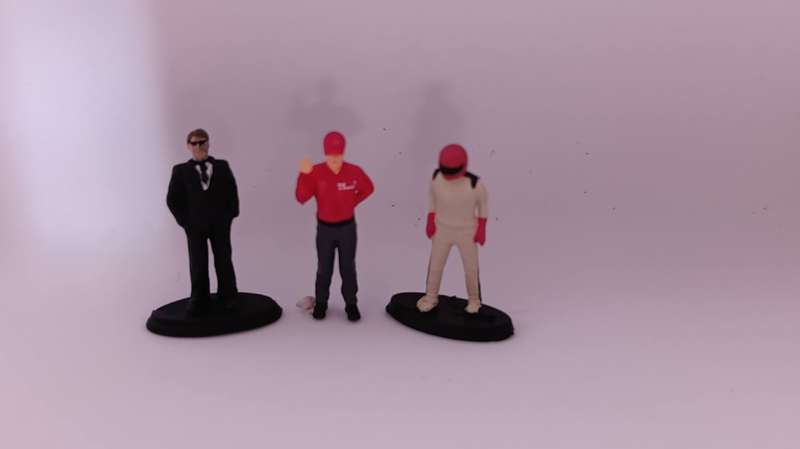 1/64 scale: three figurines: FBI agent, Shell fuel station attendant, racing driver