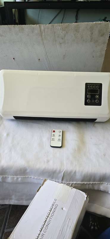 WALL MOUNT AIR CONDITIONER (HOT AND COLD) SEE DESCRIPTION