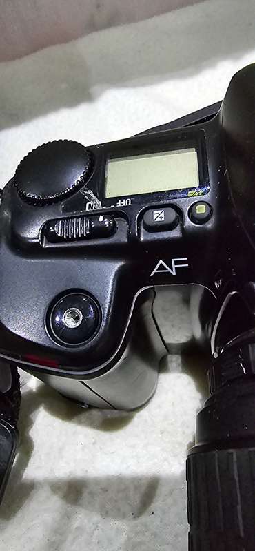 NIKON F601 CAMERA WITH LENS ,CASE AND A SPARE FILM ROLL