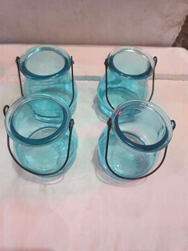 4 PIECE AQUA BLUE GLASS CANDLEHOLDES