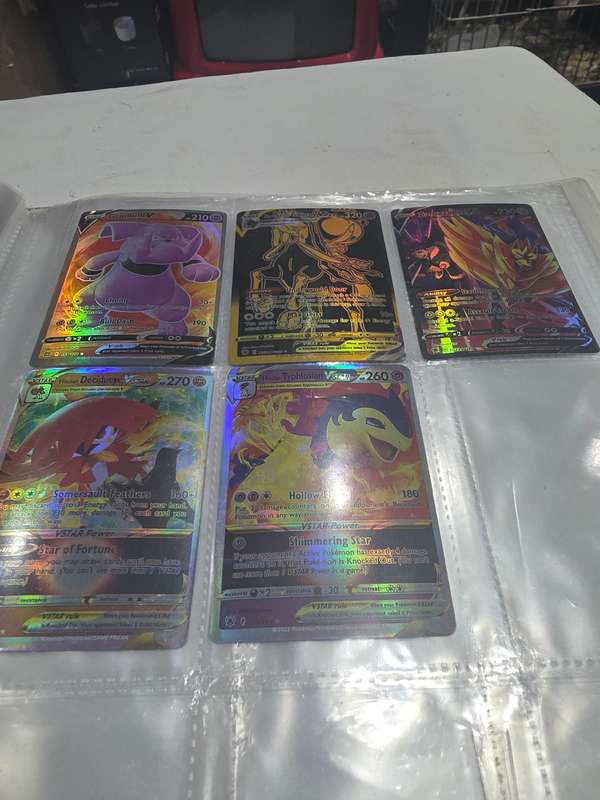 ALBUM OF 99 POKEMAN HOLOGRAM CARDS