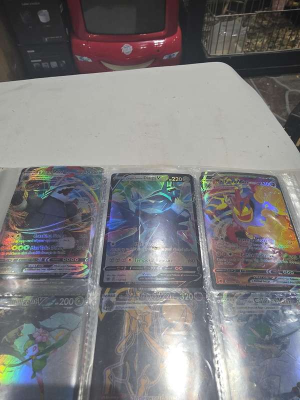 ALBUM OF 99 POKEMAN HOLOGRAM CARDS