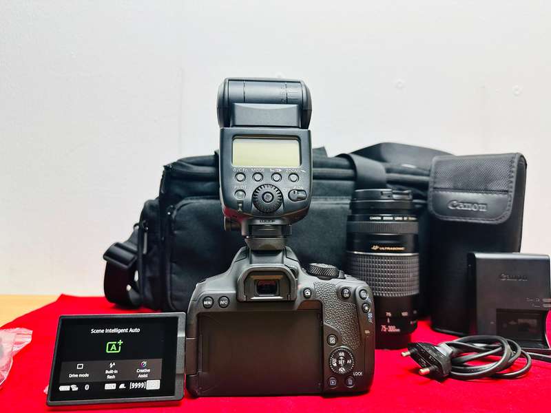 Canon EOS 850D with canon 2x lens and flash light & accessories