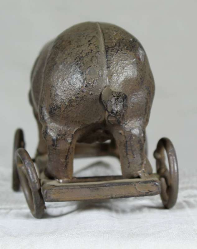 Vintage cast metal pig on wheels