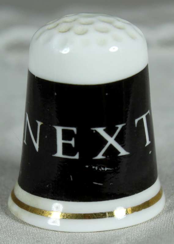 Bone China thimble - advertising - NEXT
