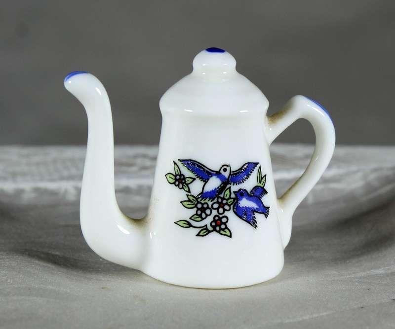 Miniature porcelain coffee pot with swallows
