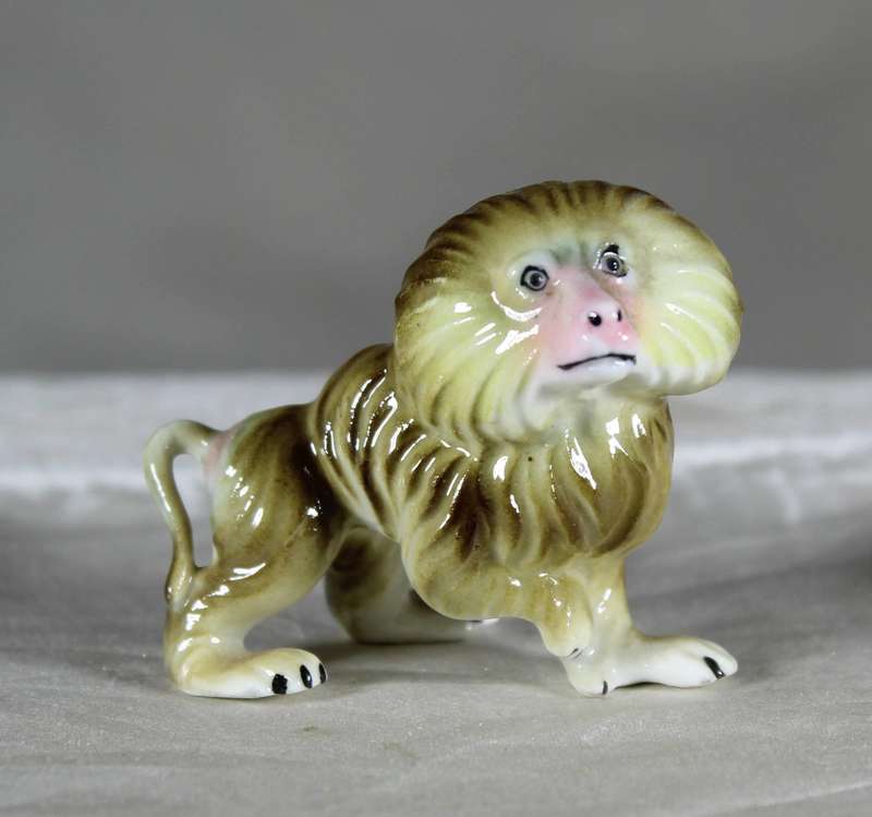 Miniature porcelain baboon