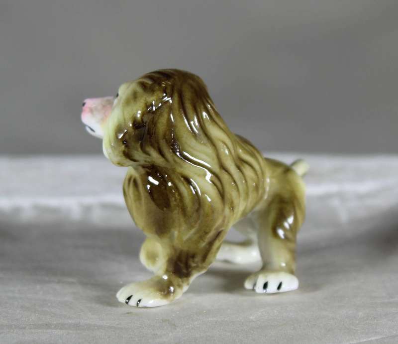 Miniature porcelain baboon