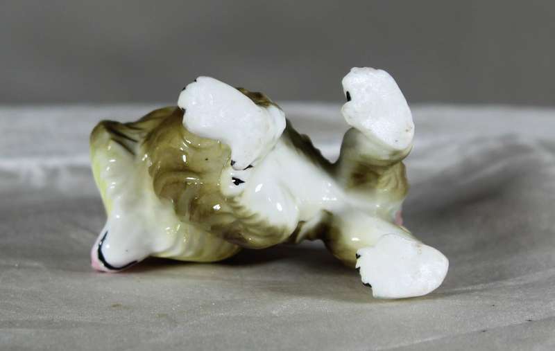 Miniature porcelain baboon