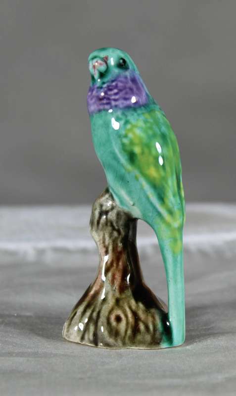 Miniature porcelain green parrot