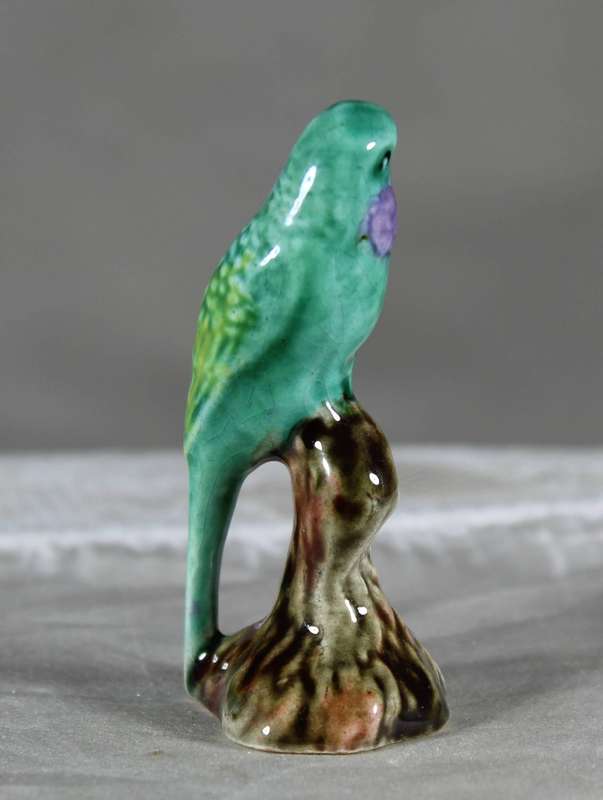 Miniature porcelain green parrot