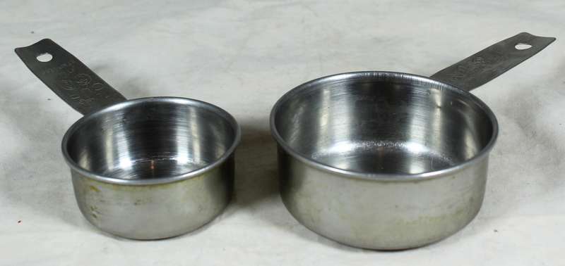 Pair of stainless steel measuring cups