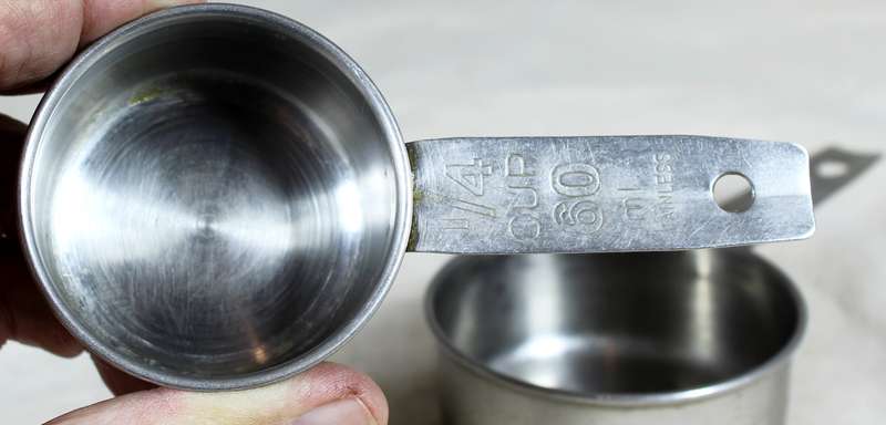 Pair of stainless steel measuring cups