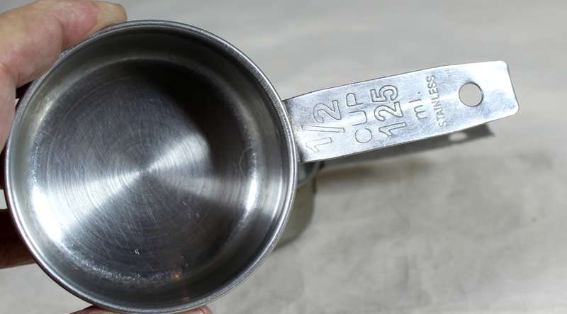 Pair of stainless steel measuring cups