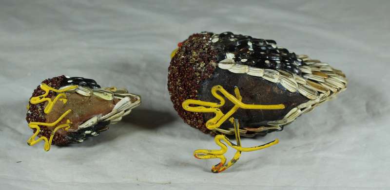 Pair of chickens covered with seeds