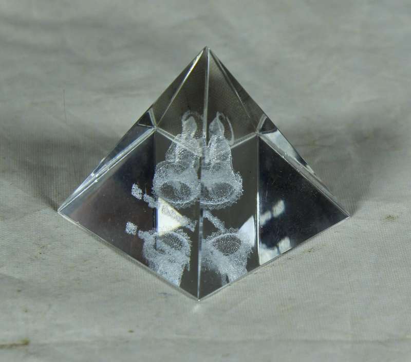 Laser etched pyramid with a deity