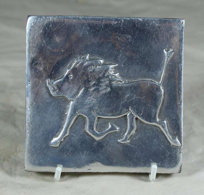 Small pewter tile with a warthog