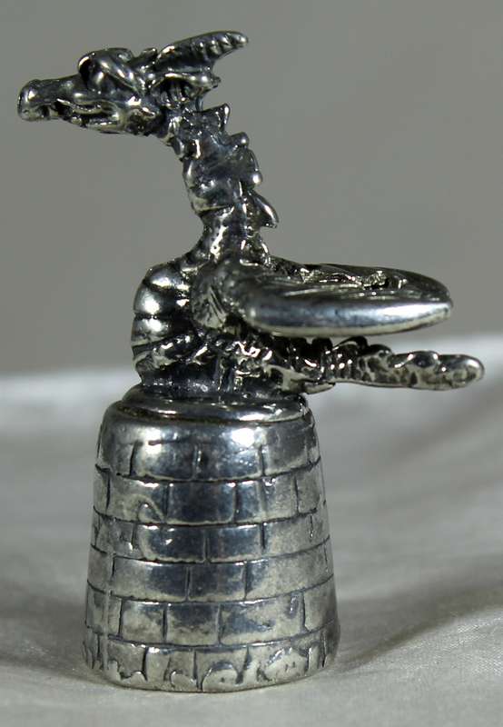 Metal thimble - dragon on castle tower