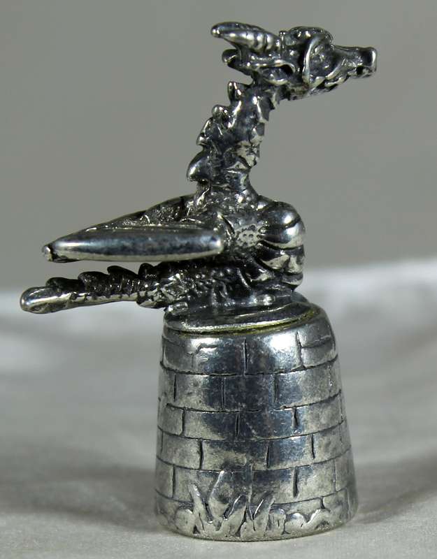 Metal thimble - dragon on castle tower