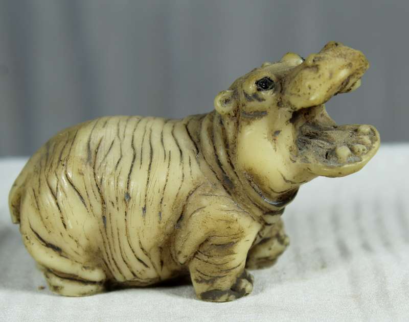 Miniature mommy and baby hippos
