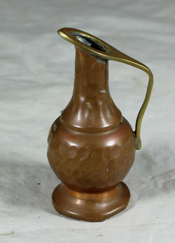 Small hand beaten copper jug