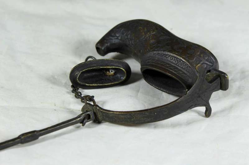 Vintage brass oil lamp in a boot shape