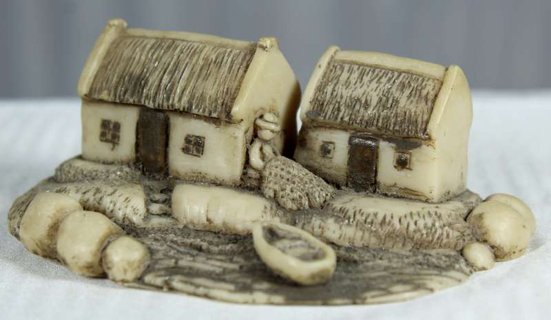 Miniature fishermen's houses with little boat