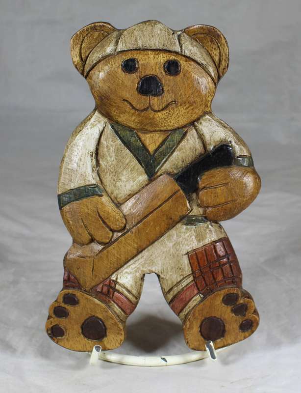Large wooden bear cricket player wall hanging